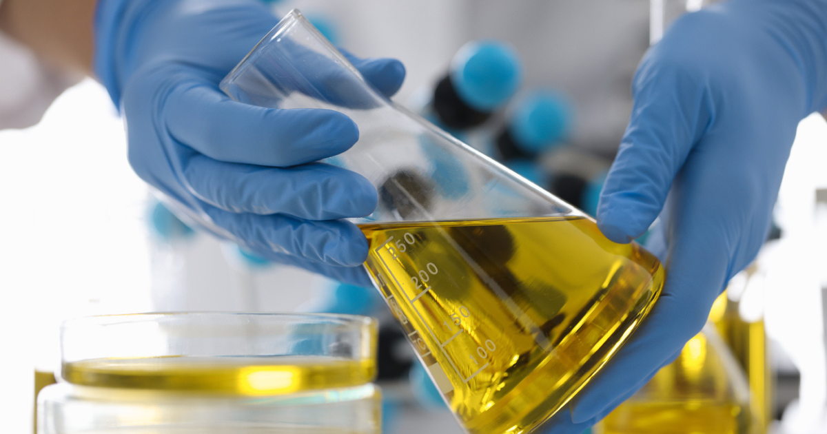 A scientist conducting butane oil extraction in the lab using USA Lab equipment.