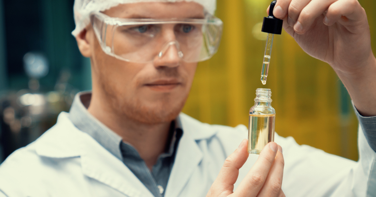 Scientest using a dropper to analyze CBD closed-loop extration oil.